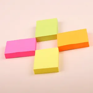 Set of four square fluorescent sticky notes in pink, green, orange, and yellow color pads.