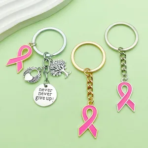 Detalle de llaveros con cinta rosa con árbol de la vida y colgantes de corazón!!