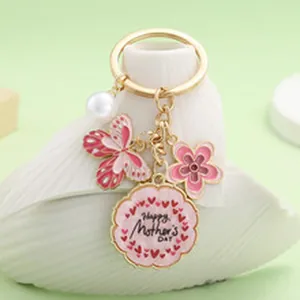 Close-up of Mother's Day butterfly and flower keychain with pearl detail