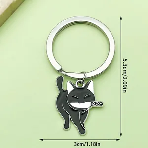 Vue détaillée du porte-clés chat noir avec couteau et dimensions indiquées.