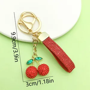 Detailed dimension view of a red rhinestone cherry keychain measuring 3.9 inches.