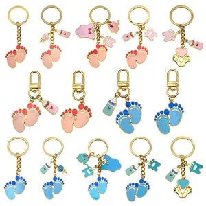 Cute baby shower enamel keychains featuring tiny feet, bottles, and baby clothes charms
