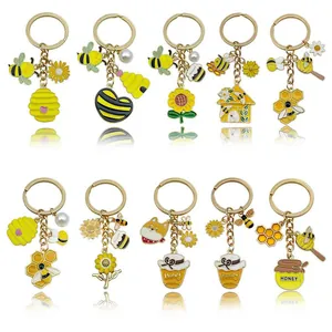 Variété de porte-clés mignons en émail avec abeilles, tournesols et pots de miel
