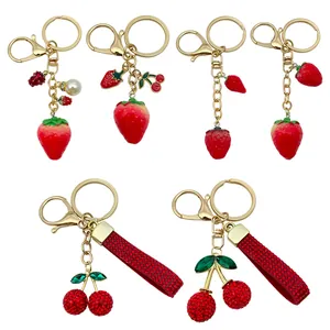 Elegant red strawberry and cherry rhinestone keychains set for women bags and gifts