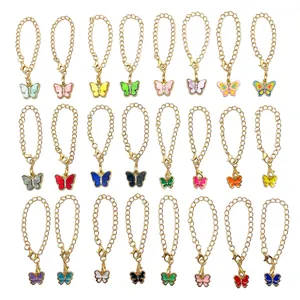 Detailed view of colorful butterfly keychains with gold-toned chains and lobster clasps