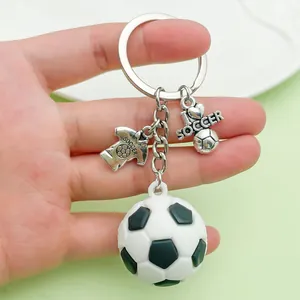 Detailed close-up of 3D PVC soccer ball keychain with I love soccer metal charms