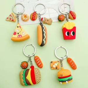 Detailed view of various PVC fast food keychains including pizza, burger and fries