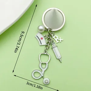 Medical theme keychain with syringe stethoscope and nurse cap charms 9.5cm length