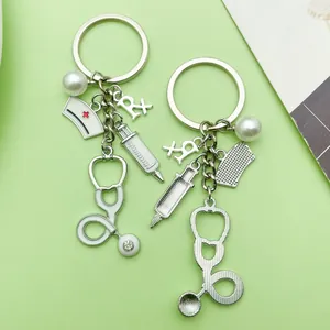 Detailed view of medical keychains with stethoscope, syringe, and nurse hat charms.