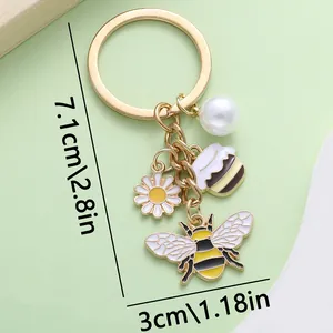 Vue détaillée d'un porte-clés abeille et marguerite avec des dimensions précises