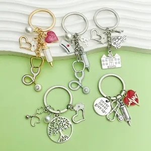 Detailed view of medical themed nurse keychains with stethoscope and syringe charms