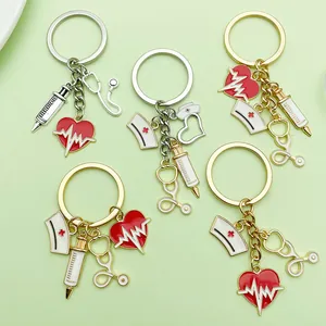 Detailed close-up of creative medical charms keychain with heart, syringe, and stethoscope