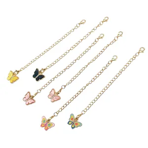 Macro view of six colorful butterfly charms with gold chains and lobster clasps