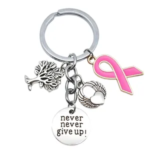 Llavero inspirador 'Never Give Up' con lazo rosa, árbol de la vida y alas de ángel
