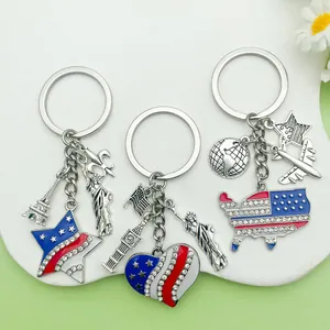 Group of three patriotic American theme keychains with Statue of Liberty and US flag charms
