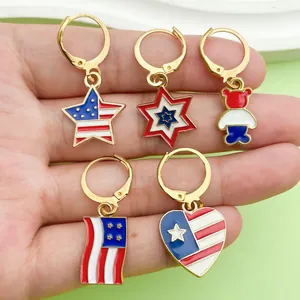 Detailed shot of American flag themed earrings with star and heart enamel pendants