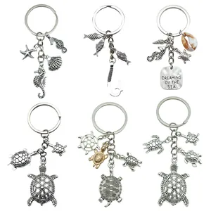 Detailed view of six silver-toned alloy keychains featuring various marine charms