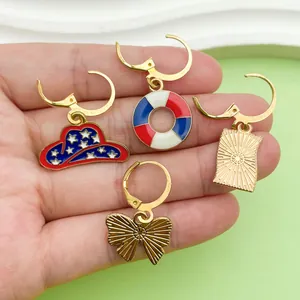 Detail view of four Independence Day alloy earrings with patriotic enamel star designs