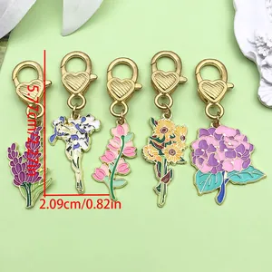Set of 5 enamel flower charms with heart-shaped clasps in colorful floral designs