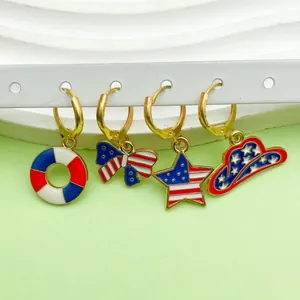 Close-up of alloy enamel earrings featuring US flag patterns for Independence Day celebration.