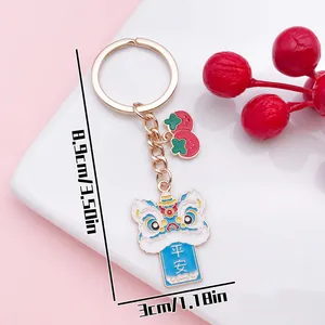 Chinese lion dance keychain with Peace banner and red strawberry charms for bags