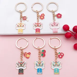 Detailed view of six different colors of traditional Chinese lion dance enamel keychains