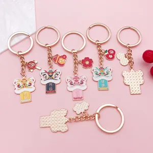 Detailed view of traditional Chinese lion dance enamel keychains with lucky charms