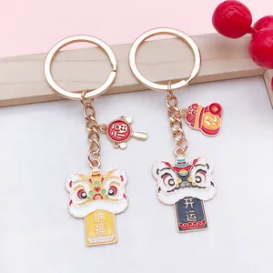Macro view of Chinese lion dance enamel keychains with lucky characters and charms