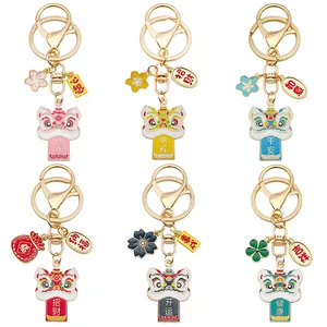 Detailed view of six colorful Chinese lion dance keychains with traditional lucky charms