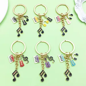 Macro view of six colorful music-themed keychains with piano, guitar and headphone charms