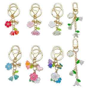 Sweet floral metal keychains with cherry blossom and lily of the valley charms