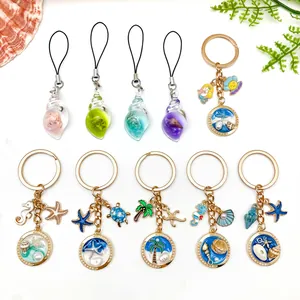 Detailed view of multiple marine-themed shell and starfish keychains with gold plating decoration