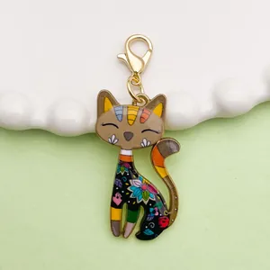 Close-up of colorful cartoon cat pendant charm with shiny enamel finish