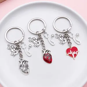 Detail view of medical theme keychains with anatomical heart and stethoscope charms.
