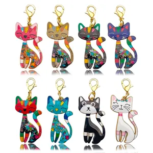 Detailed view of eight colorful cartoon cat alloy charms with golden lobster clasps.