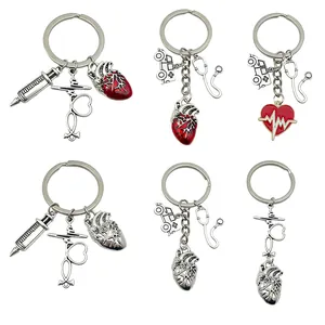 Collection of medical-themed keychains featuring heart, stethoscope and syringe charms.