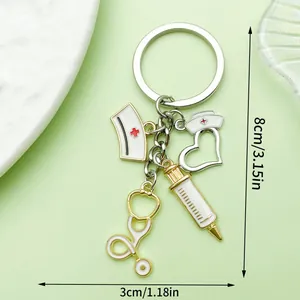 Medical themed keychain with syringe and stethoscope charms, dimensions 8cm x 3cm.