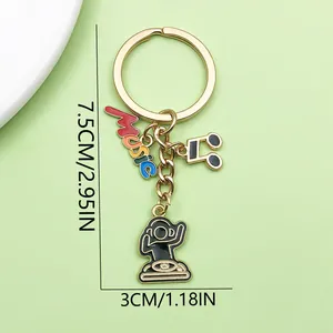Detailed view of musical theme keychain featuring DJ, note, and colorful Music charms