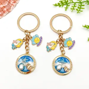 Ocean themed keychains with mermaid and starfish charms on a white background