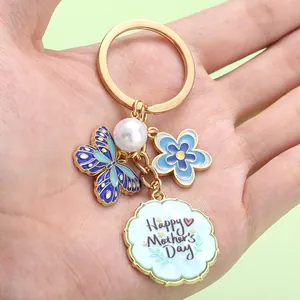 Detailed view of Mother's Day alloy keychain with butterfly and flower charms