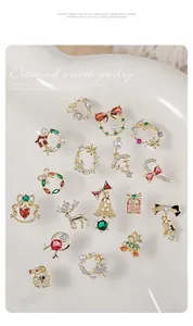 Detailed collection of Christmas nail art charms with zircon and pearls on cream white