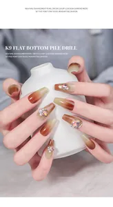 Macro view of Maillard brown gradient press-on nails with luxury rhinestones and pearls