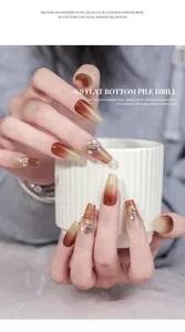 Close-up view of Maillard brown gradient press-on nails with luxury zircon and pearl charms