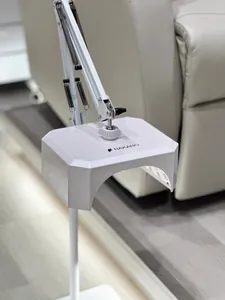 Detail of NAKANO 36W UV/LED nail lamp on an adjustable white metal arm stand