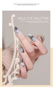 Detail showing marble-effect halo dye on long almond nails with soft artistic textures.