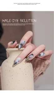 Detailed close-up view of professional marble effect nail art using halo dye solution