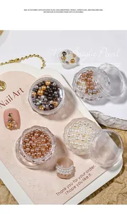 Detailed view of mixed size Maillard high-bright pearls in jars for nail art decoration