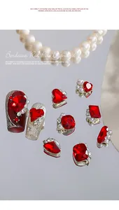 Macro view of bordeaux red nail art rhinestones and luxury diamond charms