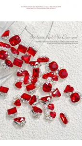 Close-up detail of Bordeaux red nail art rhinestones with elegant pearls and crystals