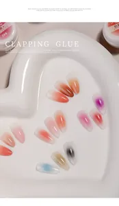 Macro view of gradient nail gel effects on tips in various shades like pink and orange.